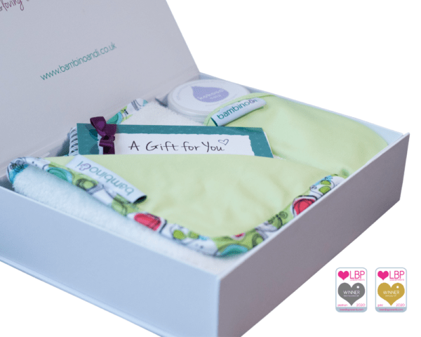Baby massage kit gift for newborn new mum new dad. The kit includes a green baby massage mat, the bumbino, kokoso coconut oil, baby massage guide, online baby massage course